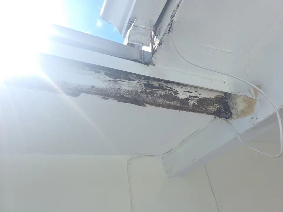 Rotted fascia board under an eave, found before new gutters went up